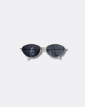 Sunglasses with dark lenses and thin frame on a light gray background