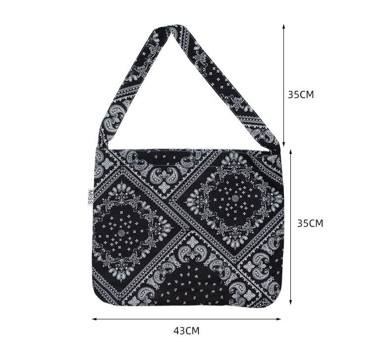 Black and white patterned bag with dimensions on a white background